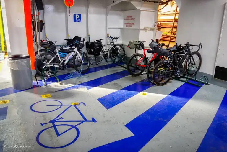 As with cars & lorries I leave my bicycle (with the three of the four panniers attached) safely in the hold for the duration of the journey