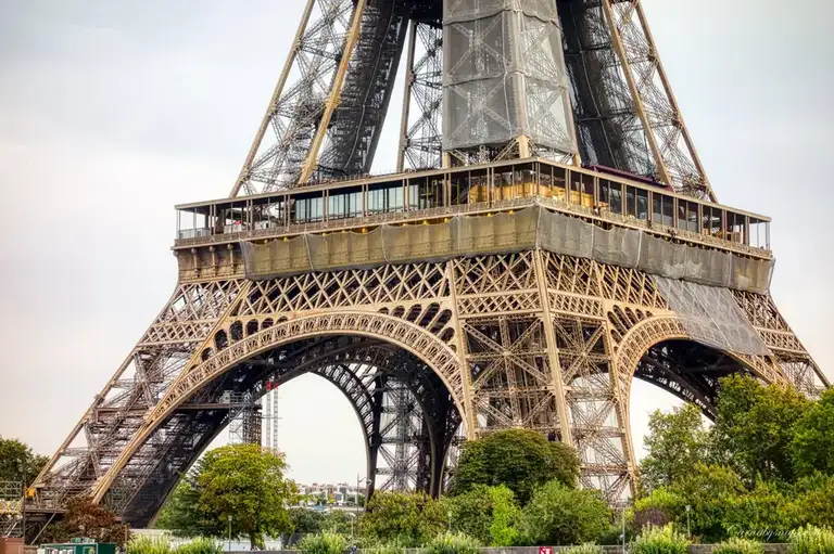 Using my compact travel cameras digital zoom I get a close-up of the bottom of the Eiffel Tower's wrought-iron lattice structure