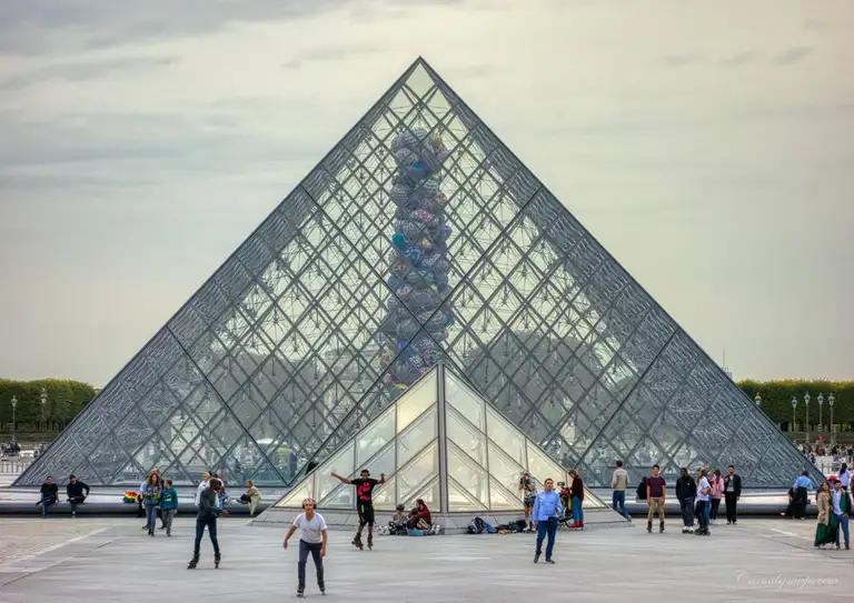 The Louvre Pyramid (Pyramide du Louvre) in the grounds of the Louvre Museum, completed in 1988 and designed by Chinese-American architect I. M. Pei