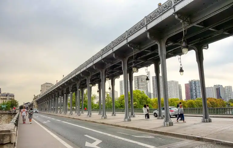 The metro crosses above this beautiful iron viaduct giving passengers a wonderful view of the Eiffel Tower