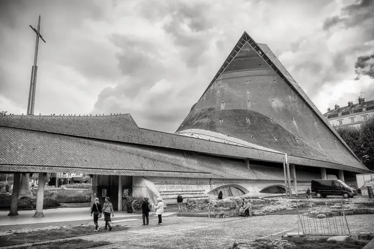 The sweeping curves of the structure are meant to evoke both the flames that consumed Joan of Arc and an overturned longship