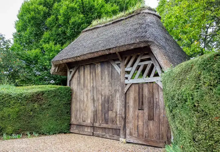 Beautiful thatched wooden gate to someone's country house
