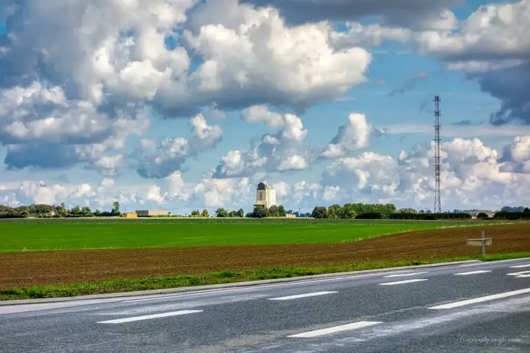 A silo can be seen in the distance as I ride through the Dieppe countryside
