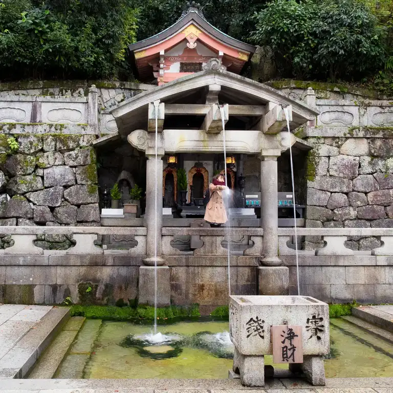 Women catching water at Otowa Waterfull Kitomizu dear Temple, Kyoto