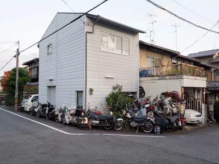  Pile of motorbikes surround house Kita Kyoto