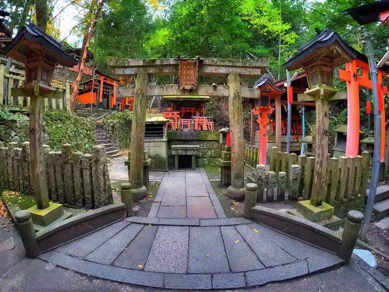 Entrance to many shrines in the wooded forest of Fushimi Inari Taisha Kyoto