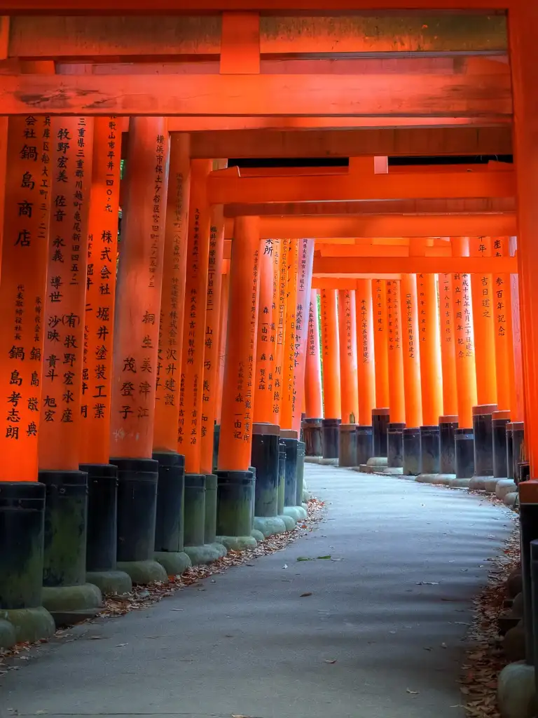Winding vermilion torii gates leading to the sacred Mount Inari at Fushimi Inari Taisha Kyoto