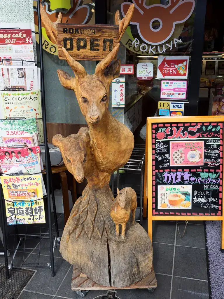 Wooden deer scuplture outside a shop in Nara Nara