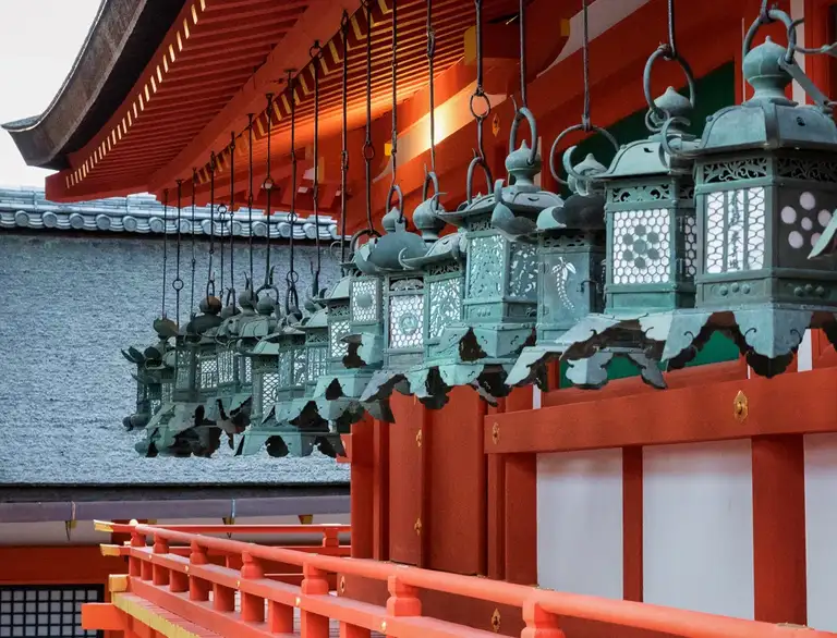  Row of bronze hanging lanterns in the grounds of Kasuga taisha Nara