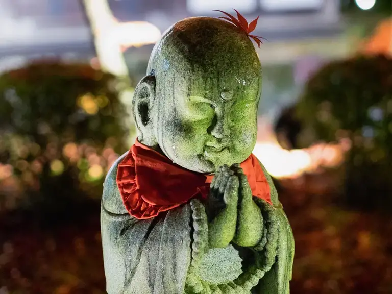 Baby Buddha Statue at the Eikando Zenrin ji autumn color night illuminations Kyoto