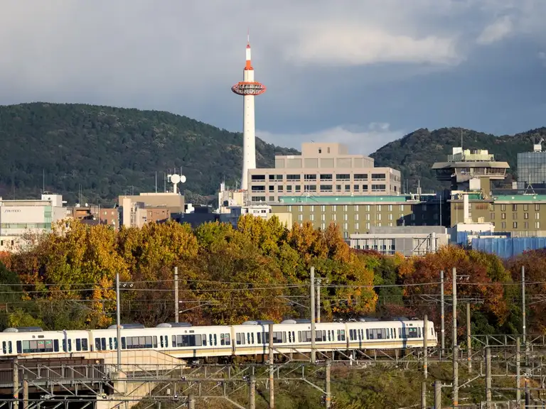 Kyoto Tower and commuter train as seen from the viewing platform at the Kyoto Railway Museum Kyoto