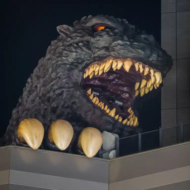  Close up of the Godzilla head above a hotel in Kabukicho at night Shinjuku