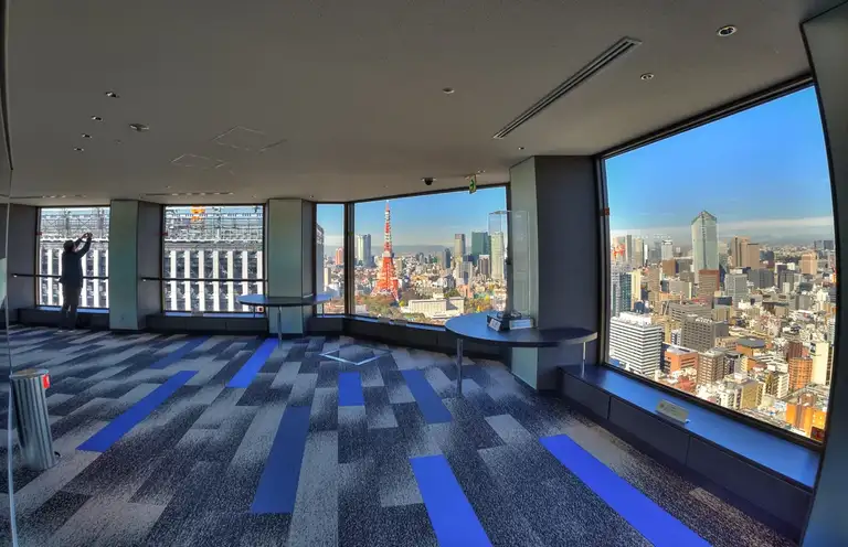 Looking out from inside at the Tokyo Tower at the Seaside Top Observatory at the World Trade Center Minato