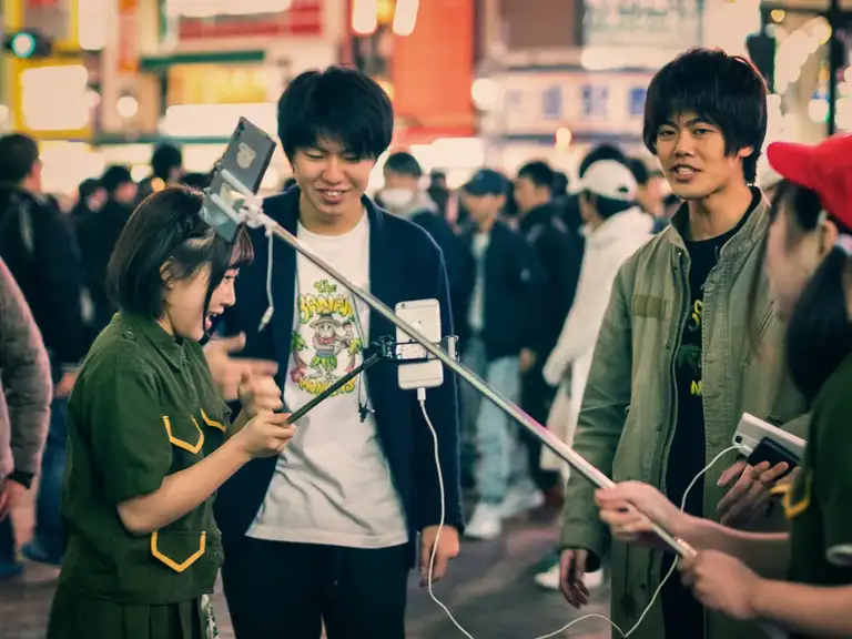 Japanese vloggers filming a show at Shibuya crossing Shibuya