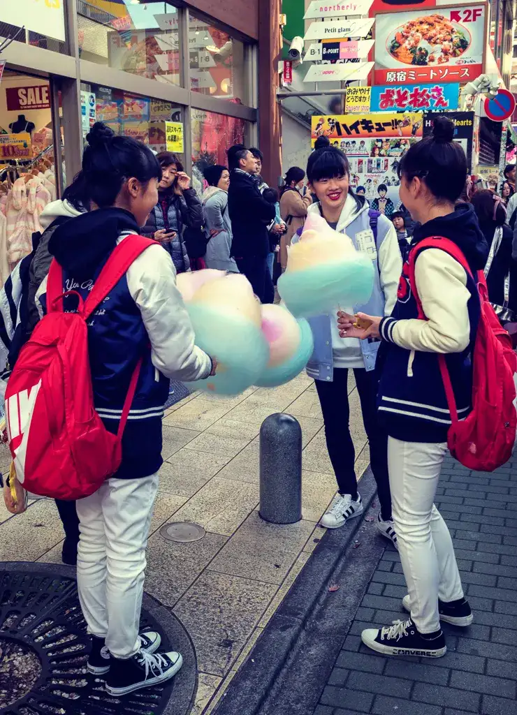 Girls with colorful candy floss in Takeshita Street Harajuku