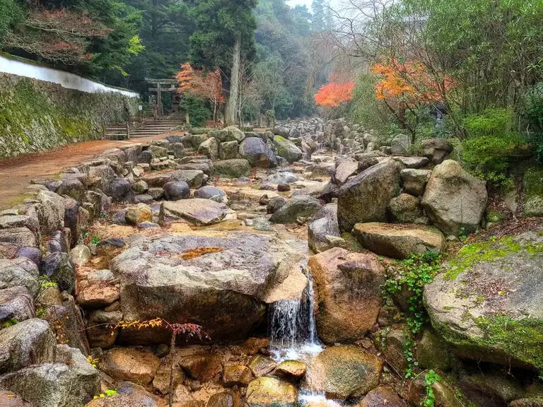  Water flows down a rock pool from the Mount Misen near the entrance of Daisho in Temple Miyajima Island