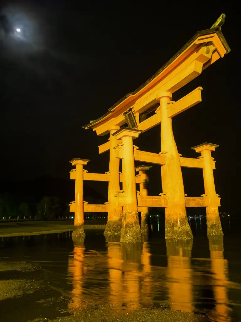 The O Torii Gate at night with the moon in the sky and the tide going out Miyajima Island