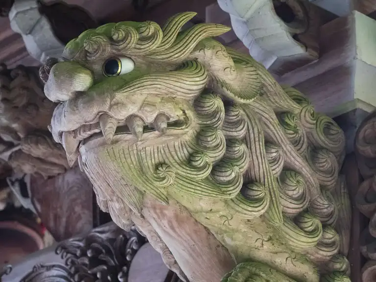 Decarotive wooden carving under the roof tiling of Maniden Hall Daisho in Temple Miyajima Island