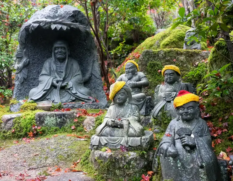 The 500 disciples of Shaka Nyorai some with yellow hats Daisho in Temple Miyajima Island