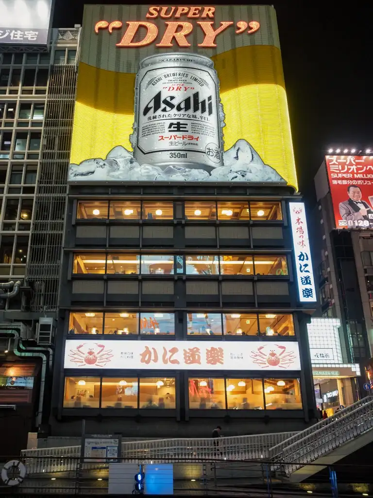  Asahi Super Dry sign lit up over Dotombori canal Osaka Night time