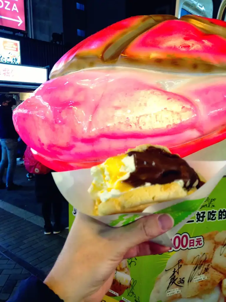  Melonpan bread sandwich with ice cream and mango sauce in Dotombori Osaka Night time